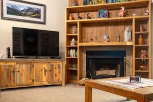 Relax by the wood burning fireplace after a day on the mountain