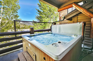 Bubbling private hot tub with mountain views