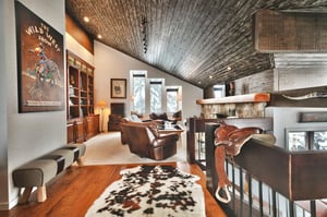 Upper level living area, cowhide area rug and western decor