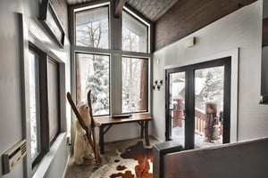 Entryway with bright natural light and welcome ski polar bear