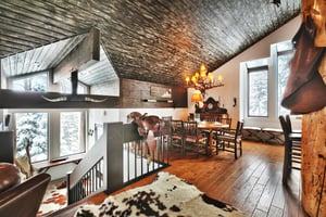 Upper level living room opens up to the dining room
