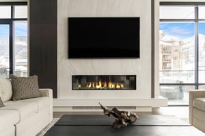 Spectacular quartz feature fireplace wall with gas fireplace and large screen TV