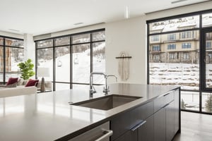 Perfectly situated kitchen island overlooking the pool deck and ski runs
