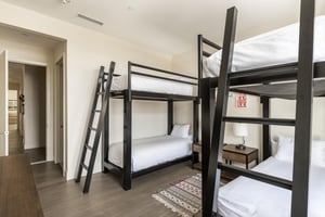 Sleep 4 in this guest bedroom with 2 bunk bed sets, large ladders for easy access to the top bunks
