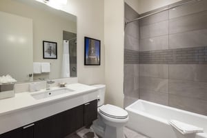 Ensuite full bathroom for the bunk room with shower tub combo