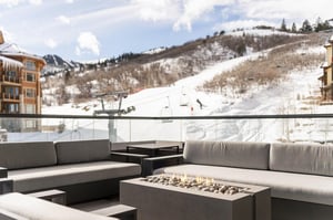 Gas fireplace and lounge area on the private patio with stunning mountain views