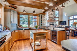 Expansive chefs kitchen with chopping block island and dedicated wine cooler
