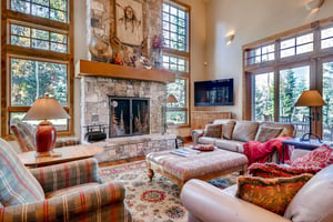 Sumptuous living room, wall mounted flat screen TV, feature flagstone fireplace and plenty of comfortable seating