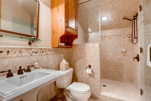Attractive tiled guest bathroom with walkin shower