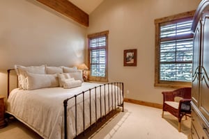Superb comfort king bed in fourth guest bedroom, iron bedframe, large picture windows