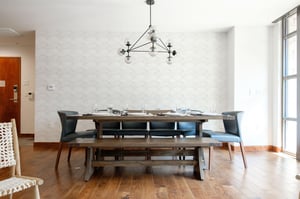 Elegant dining room with geometric glass and iron chandelier
