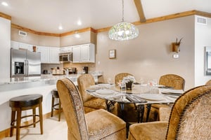 Inviting dining table seating 6  ParkCityLodging_PowderRunC11_Dining2