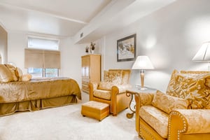 Gracious main bedroom king bed comfy chairs