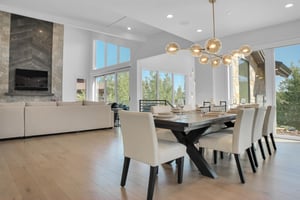 Vacation rental dining area with views of the living rooms floor to ceiling windows.