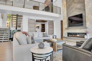 Vacation home living room with stunning modern finishes, high ceilings, and comfortable furnishing.