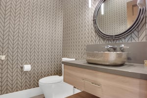Vacation rental half bathroom near in the ground level area.