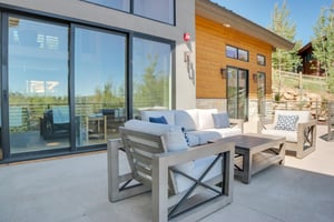 Vacation rental patio with the living room sliding glass doors behind it and the main suite sliding glass doors as well.