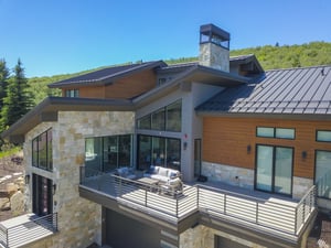 Vacation rental patio that showcases the spacious size and is wrapped with modern railing.