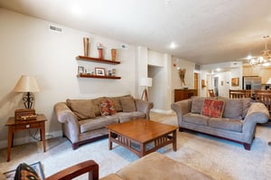 Abundant comfortable seating throughout livin groom
