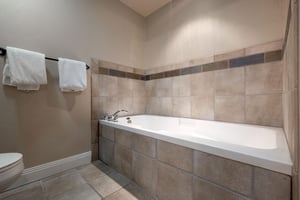 Soaking tub in the main bathroom