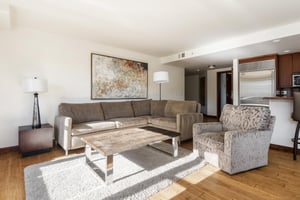 Relaxing sectional in the living room with additional lounge chairs