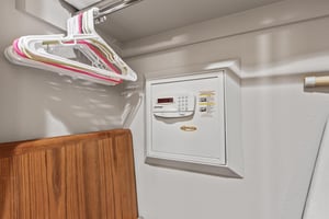 Snow Flower 72s built in wall safe in a closet with hangers.