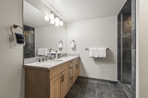 The fourth bedroom has an en suite bathoom with walk in shower.