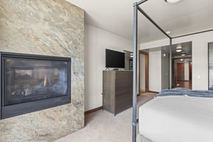The main suite has a king size bed with a gas burning built in gas burning fireplace and floor to ceiling stone surround.