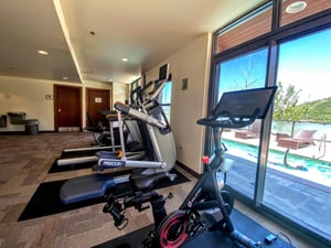 Lowell fitness center stationary bikes, treadmill, and Peloton