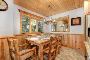 Timber Wolf Lodge 10 Ds dining area with wood table set for 6 and seating for 6.