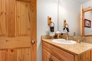 A powder room located next to the main living area.