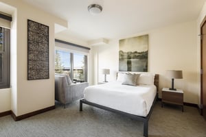 Guest bedroom 2 with window side lounge chair