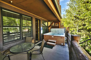 Spacious private deck with hot tub and patio dining set