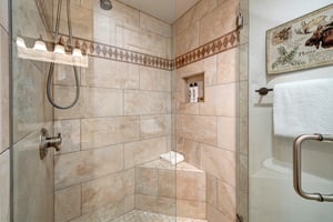 The second bedrooms shared bathroom has a walk in shower.
