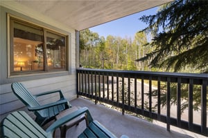 The private balcony has large sliding glass doors and seating to take in the view.