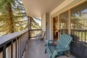 The private balcony has large sliding glass doors and seating to take in the view.