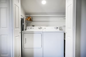 Side by side washer dryer in the loft area