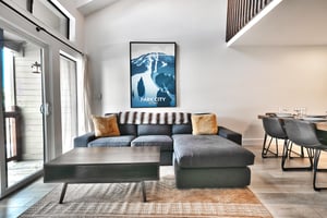 Sectional sofa in the living room accented with Park City mountain art