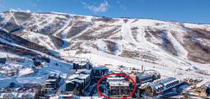 Lowell 402 aerial showing skiinskiout proximity to the snow capped slopes.