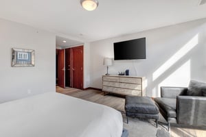 Lowell 402 offers a king size bed in bedroom 2, with a flat screen TV and dresser.