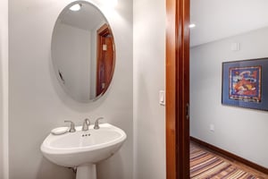Lowell 402 common bathroom with pedestal sink.