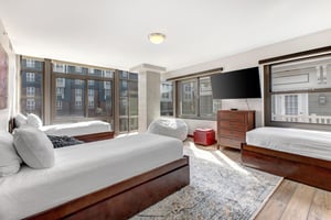 Lowell 402 with three twin beds and flat screen TV.