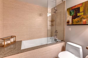 Lowell 402 bathroom with bathtub and shower combination.