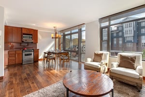 Lowell 402s open concept living room, dining area, and kitchen.