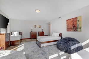 Lowell 402 with three twin beds and bean bag seat.