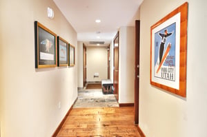 Second entryway with bench and slate stone tile before going to hardwood floor