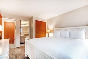 The main suite offers a king size bed and attached bathroom.