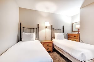 The second bedroom offers two twin size beds.