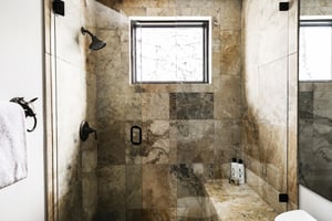 A bathroom with a walkin shower.