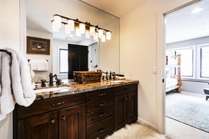 A bathroom with a double sink vanity.
